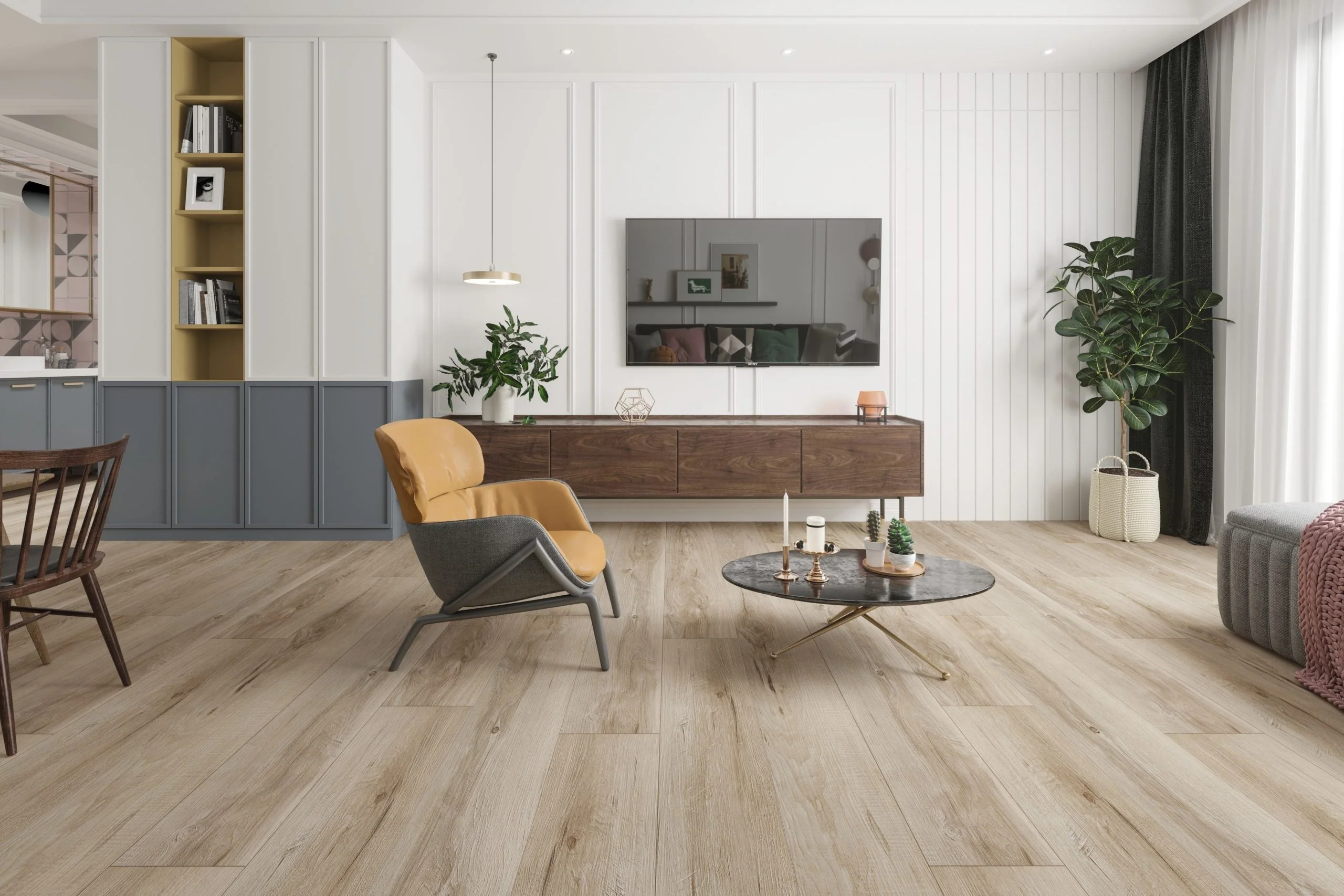 A modern living room showcases light wood flooring from a top-notch flooring supplier, featuring a yellow chair, a round coffee table, and a TV with plants flanking the wooden cabinet beneath.