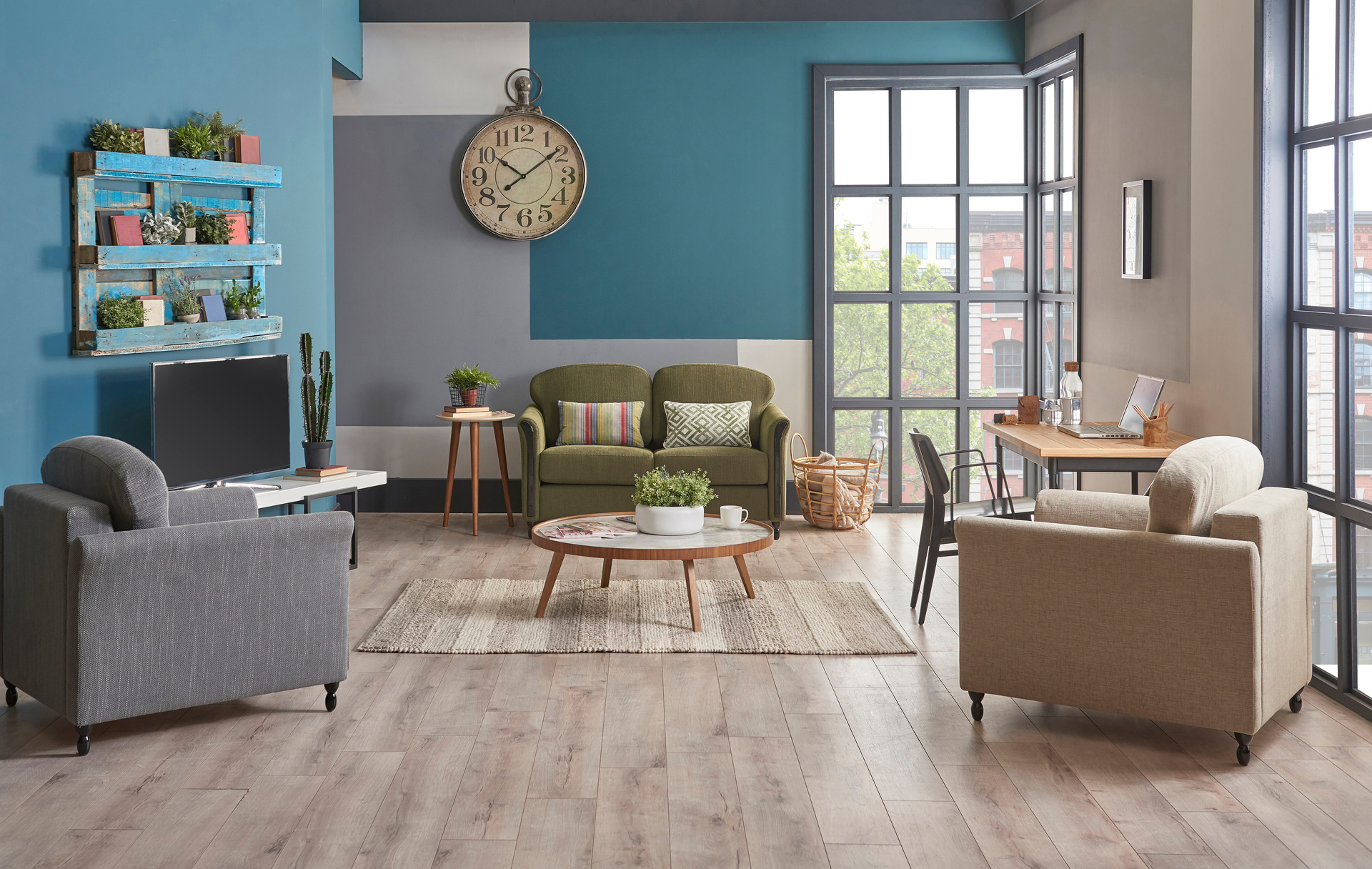 A modern living room with two armchairs, a sofa, and a coffee table showcases elegant flooring by a renowned Florida flooring supplier. Potted plants add freshness, while large windows flood the space with natural light. A wall clock adds a stylish finishing touch.